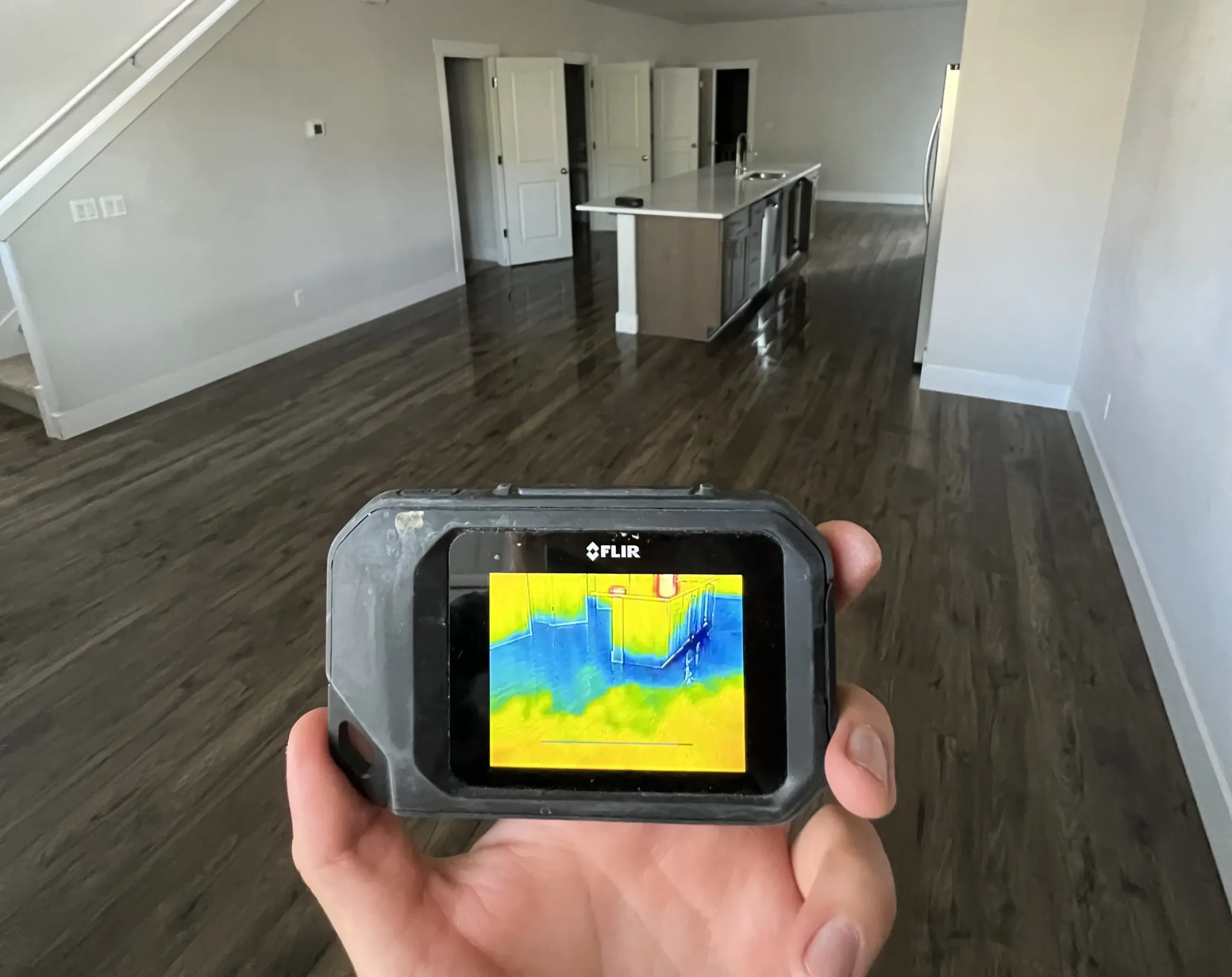 Handheld thermal camera used during an interior inspection