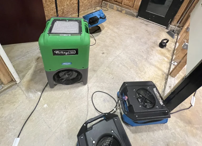 Portland NW dehumidifier and air movers in a room with exposed framing